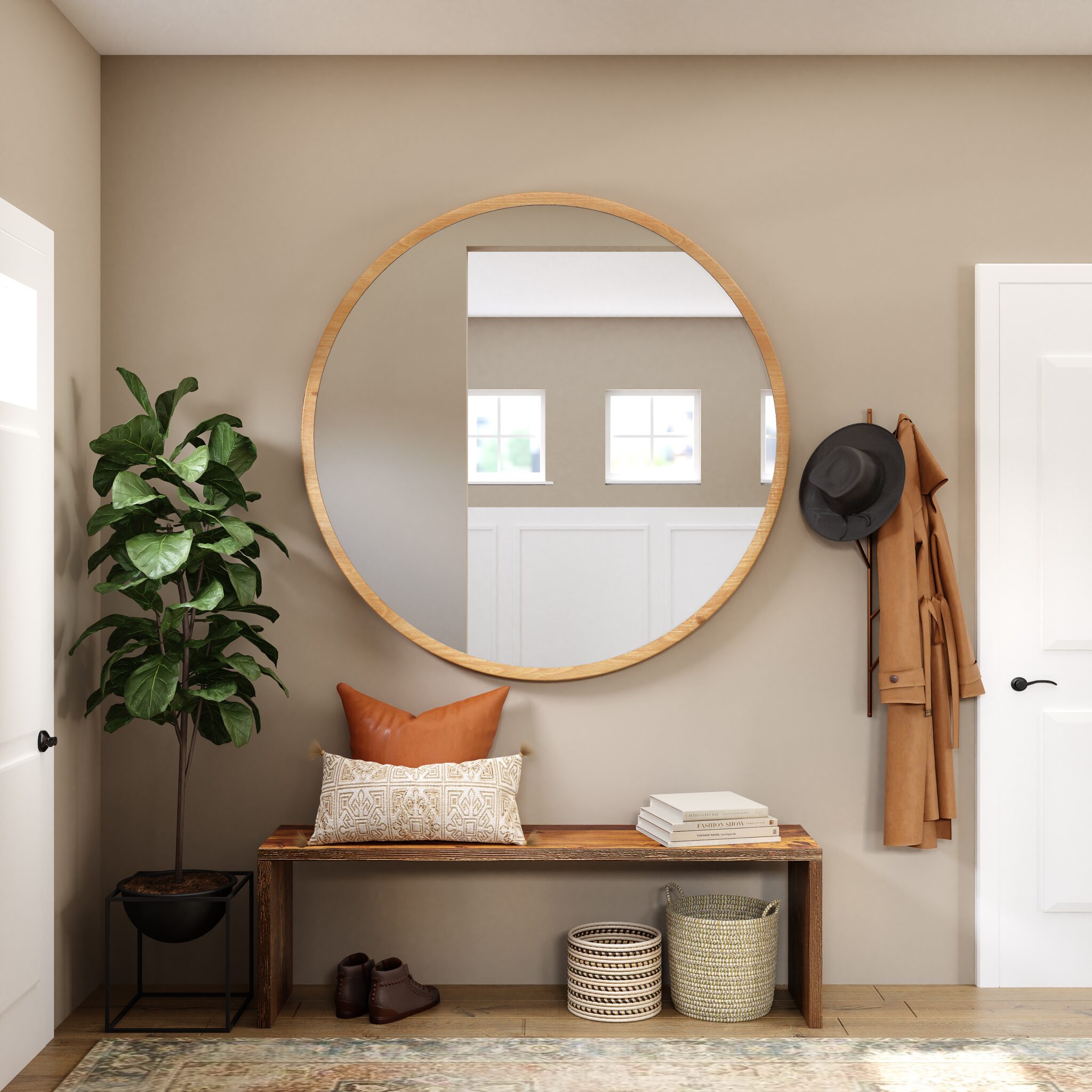 A round mirror hanging on the wall above a bench.